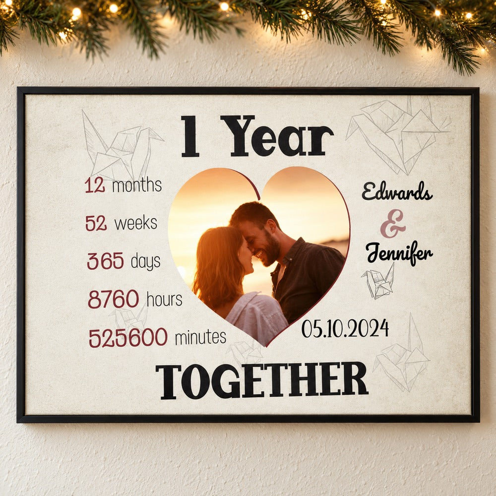 Custom 1 Year Together couple photo canvas print hanging on wall with holiday garland