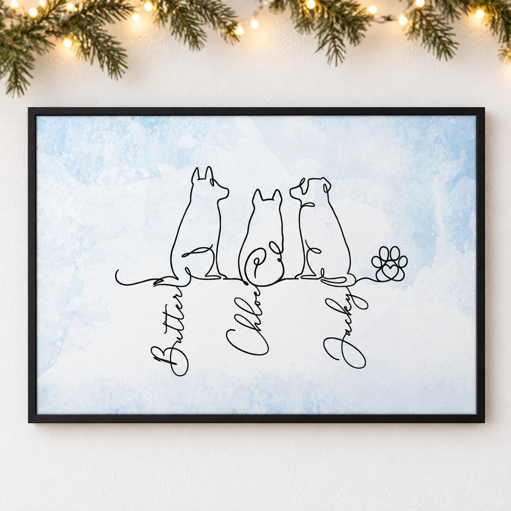 Personalized dog line art canvas print hanging on a wall with soft holiday greenery