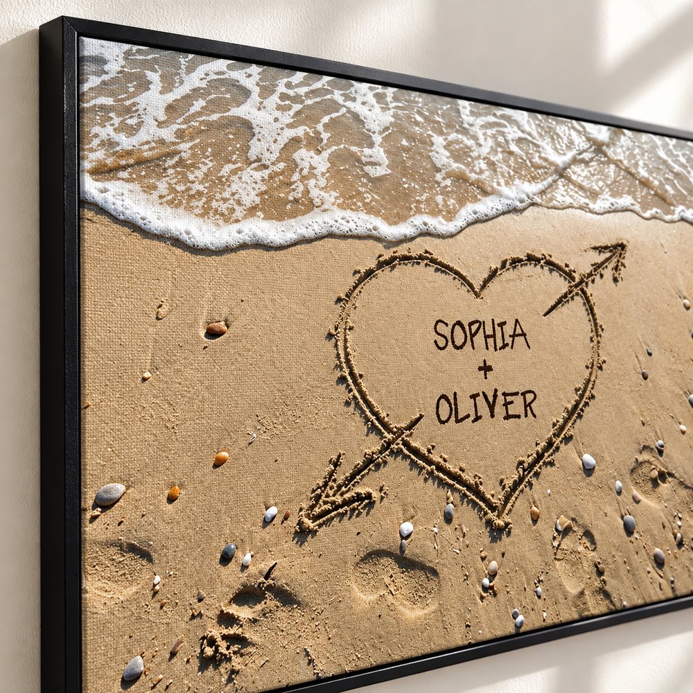 Close-up detail of personalized couple names heart in sand canvas texture and frame