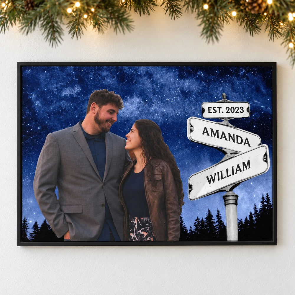 Personalized couple street sign canvas print hanging on a wall with holiday garland and lights