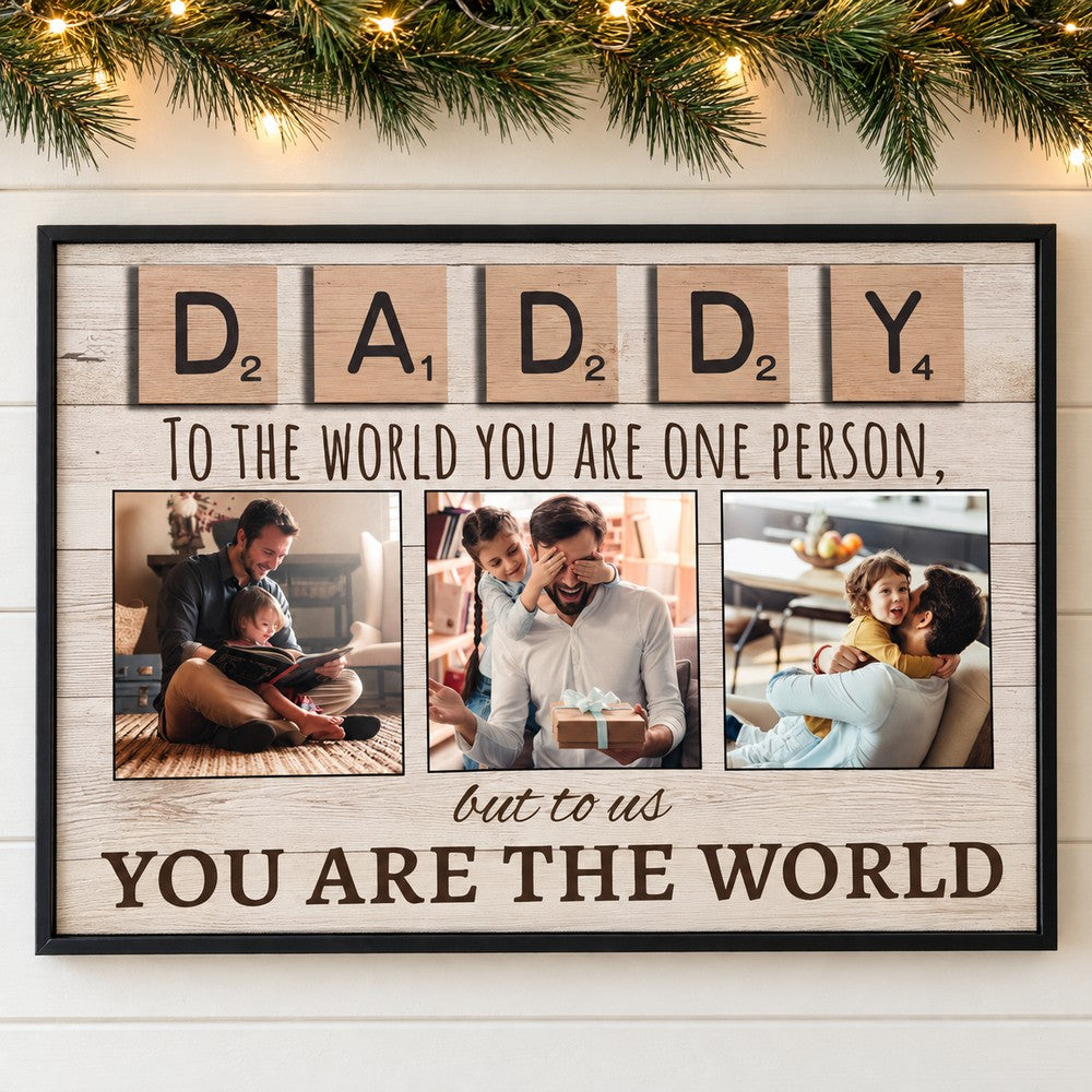 Personalized Daddy photo collage canvas hanging on wall with holiday pine garland
