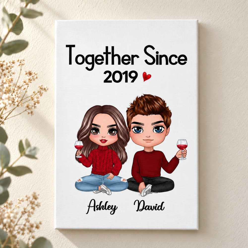Doll couple sitting personalized canvas print displayed on a bright neutral wall