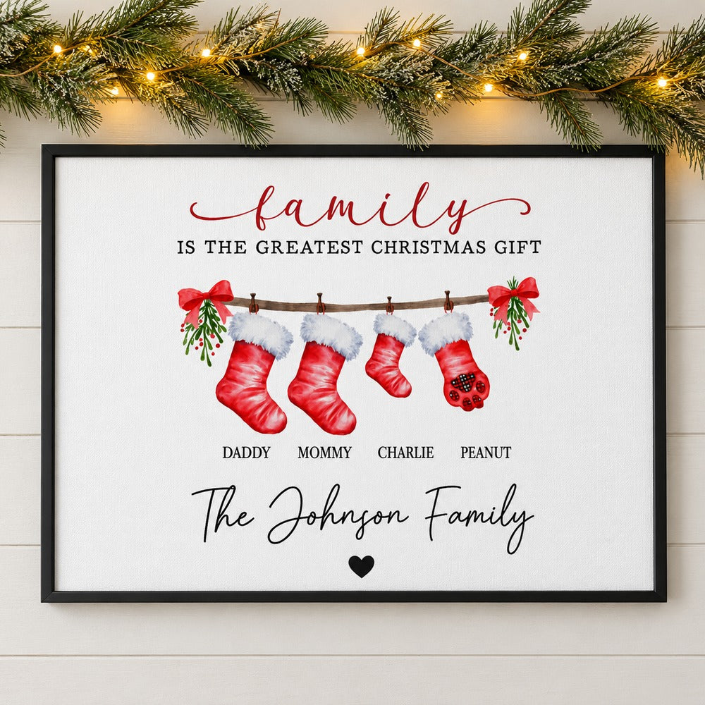 Family Is The Greatest Christmas Gift personalized framed canvas on wall with pine garland