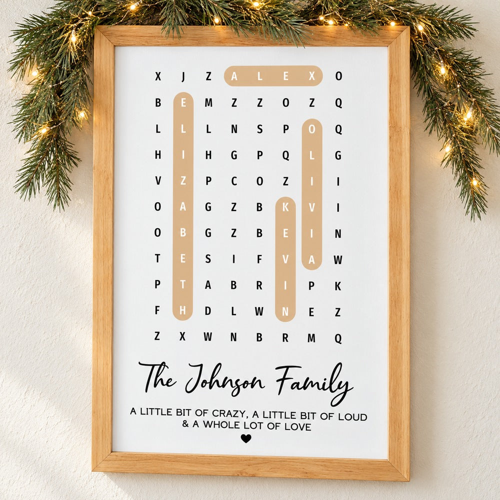 Personalized family name word search framed canvas print on wall with holiday pine garland
