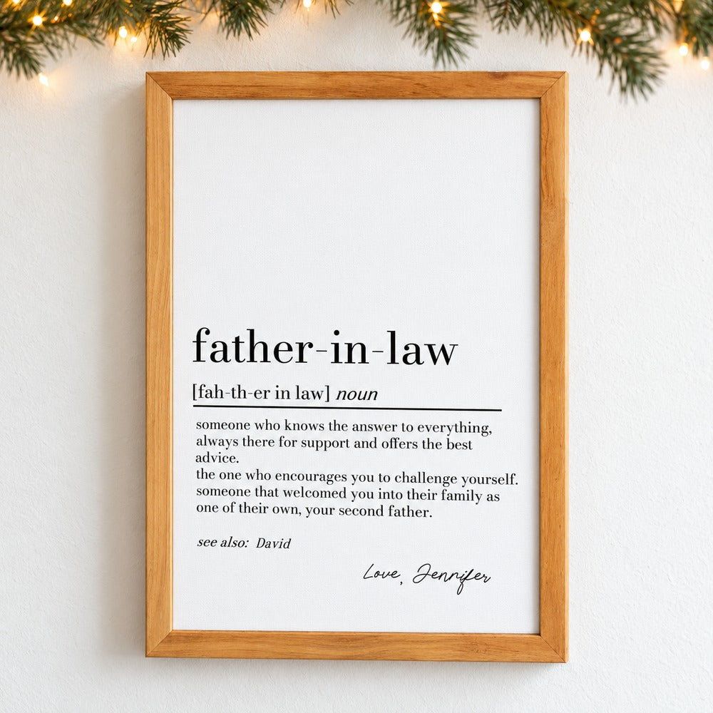 Personalized father in law definition framed print hanging on wall with holiday garland