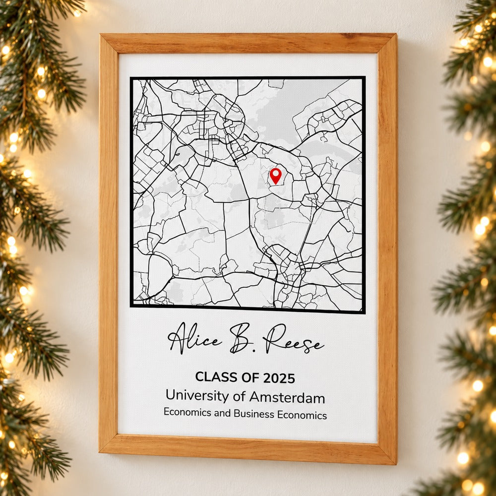Framed graduation gift map print on wall with holiday garland and warm fairy lights