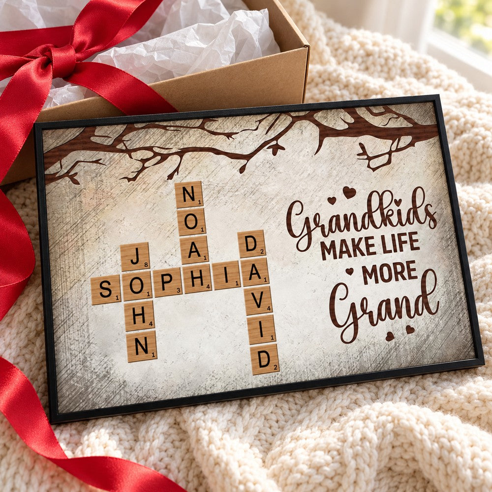 Personalized grandkids crossword canvas next to holiday gift box with red ribbon