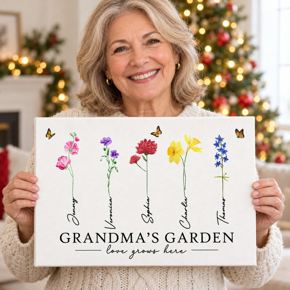 Smiling grandma holding her personalized Grandmas Garden watercolor birth flower canvas gift
