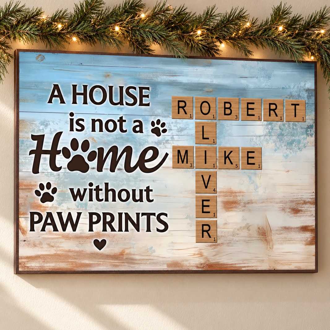 Personalized pet paw prints scrabble canvas hanging on wall with holiday garland