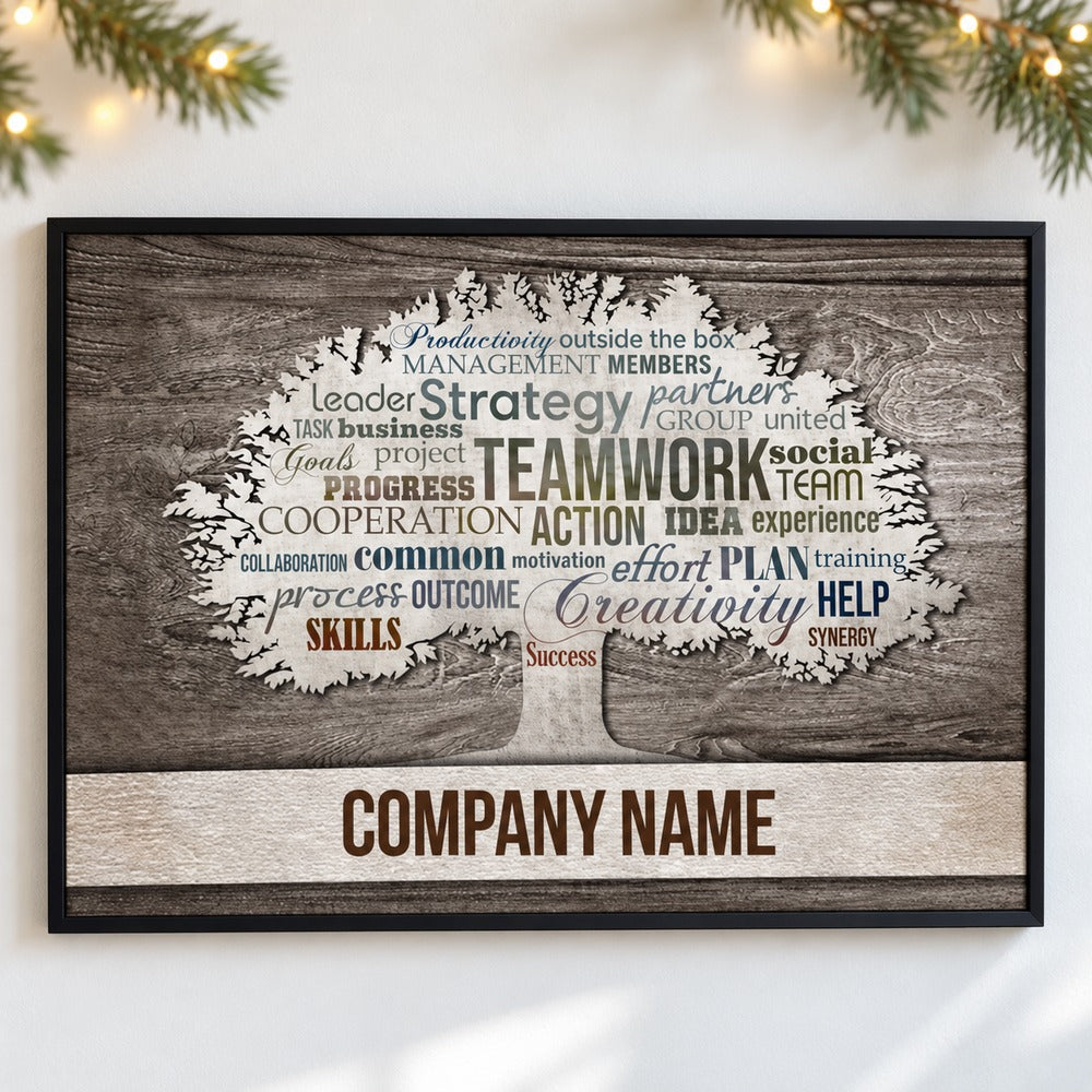 Motivational office canvas wall art hanging on wall with holiday greenery