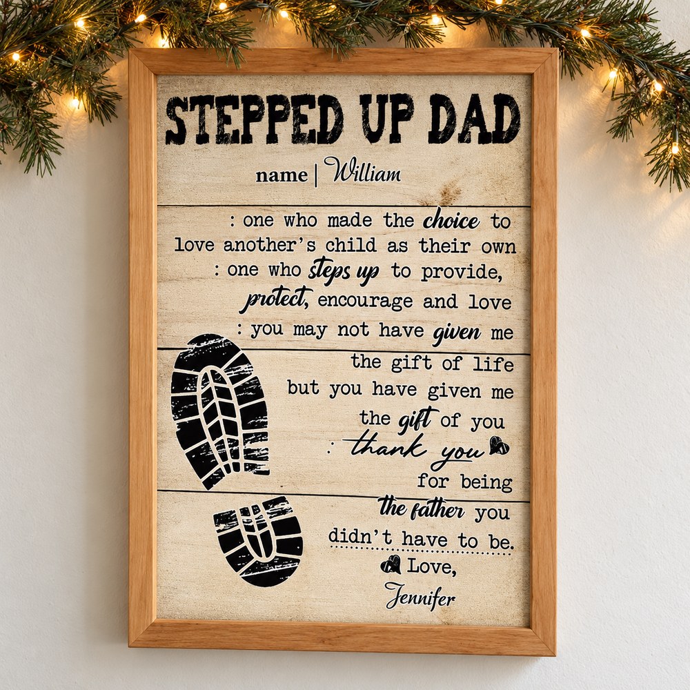 Personalized Stepped Up Dad framed canvas print hanging on a wall with holiday pine garland