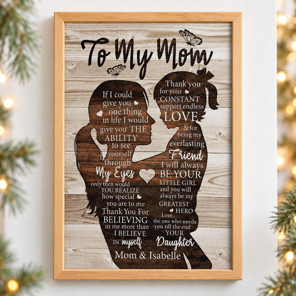 Personalized To My Mom canvas print on wall with holiday pine greenery and fairy lights