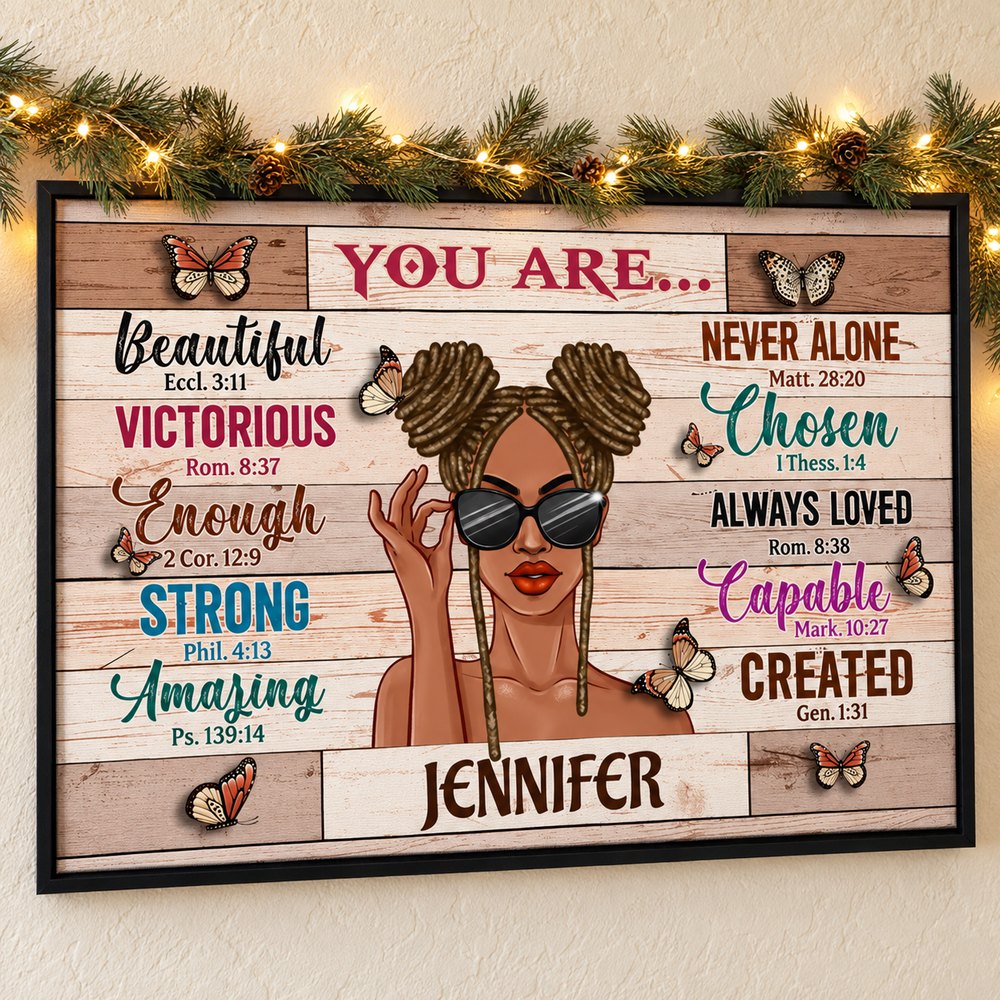 Personalized Black woman affirmation canvas print hanging on a wall with holiday pine garland and fairy lights