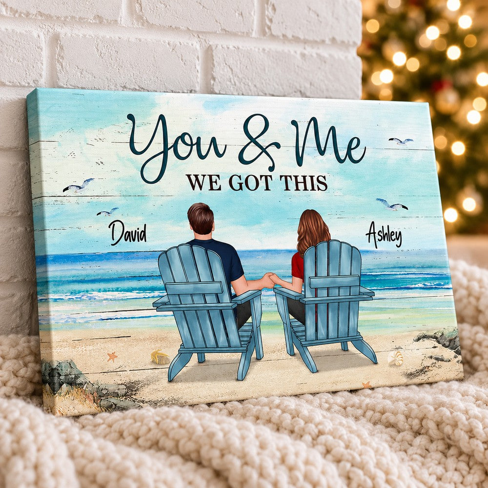Couple beach landscape personalized canvas leaning against a white brick wall with festive lights