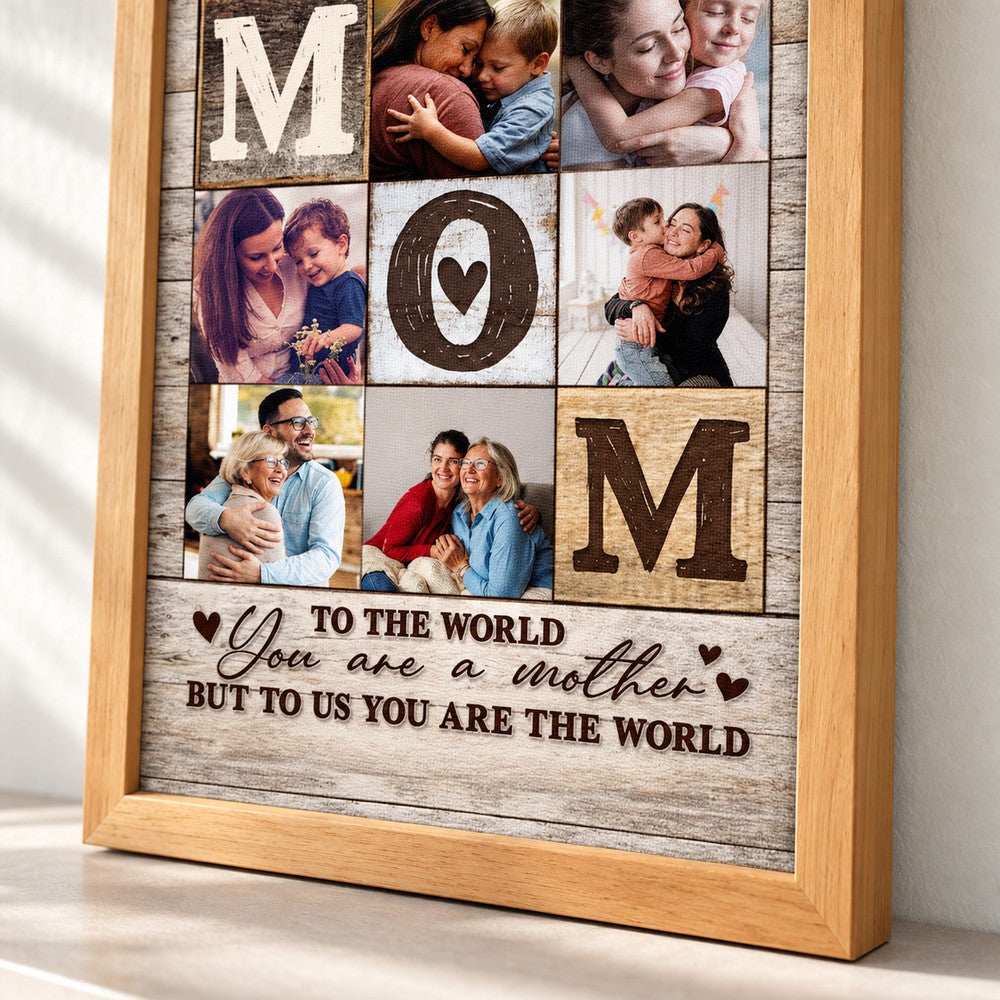 Close-up detail of wood frame and textured canvas print reading To Us You Are The World