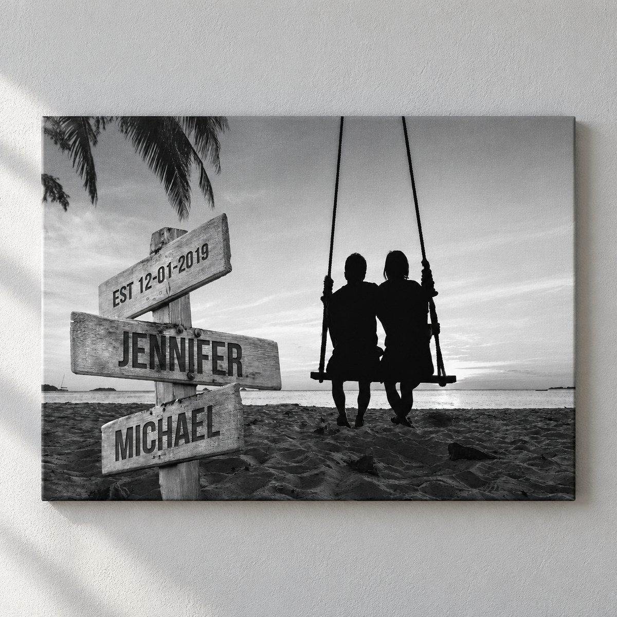 Personalized couple beach swing canvas print displayed on a modern gray wall