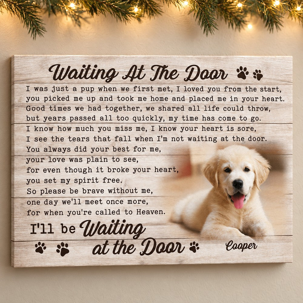 Personalized pet memorial canvas displayed on a wall with soft holiday greenery and fairy lights