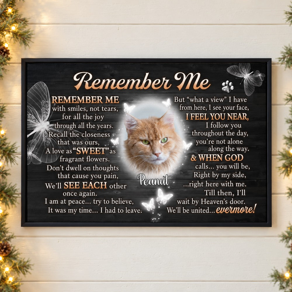 Personalized pet memorial canvas print with cat photo hanging on wall with holiday greenery