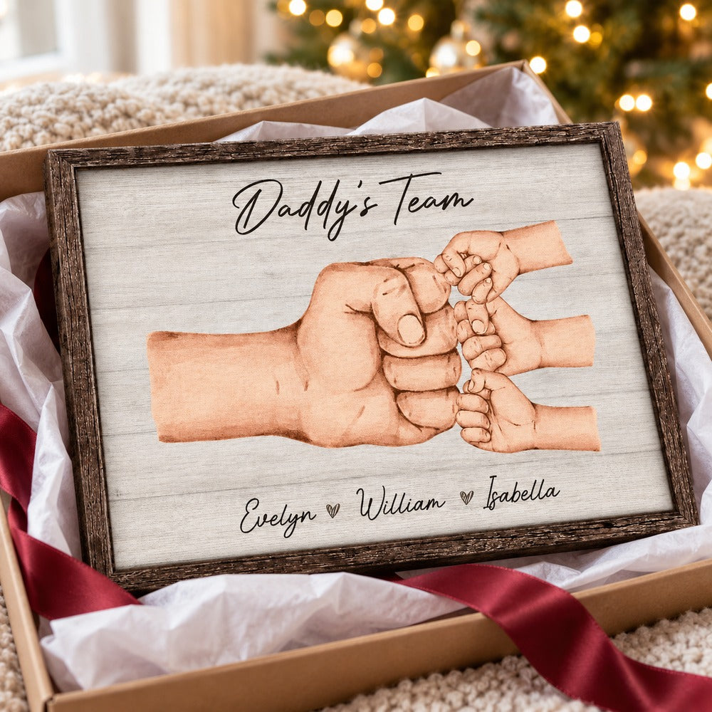 Daddy's Team personalized canvas print unwrapped in a holiday gift box with ribbon