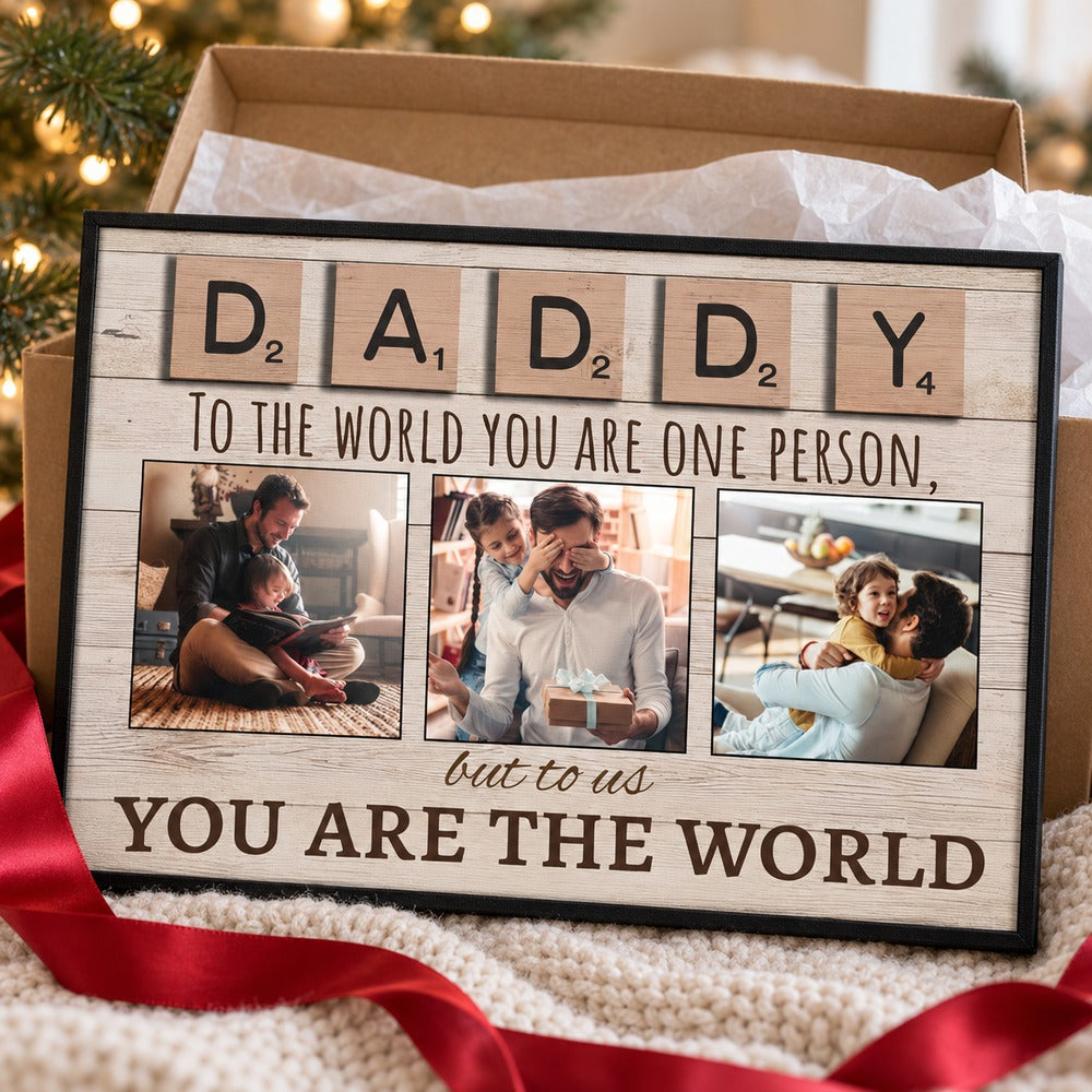 Personalized Daddy photo canvas next to a holiday gift box with red ribbon