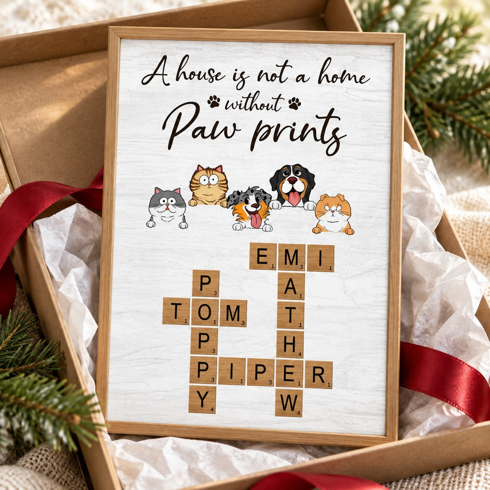 Personalized paw prints crossword canvas print next to a holiday gift box with ribbon
