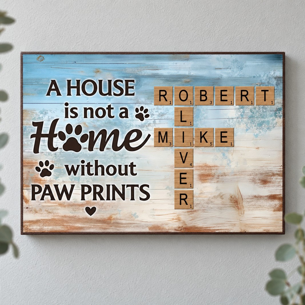 Home with paw prints personalized canvas displayed on a bright neutral wall