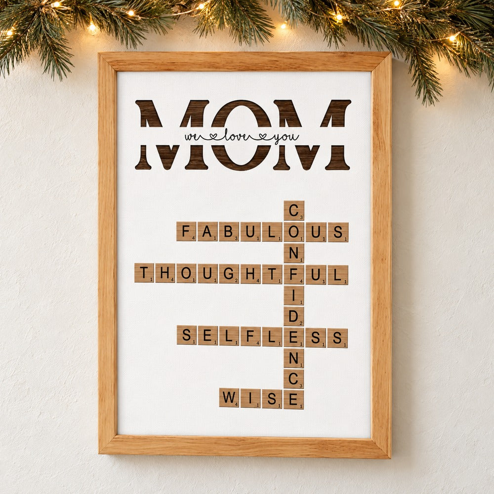 Personalized MOM crossword puzzle framed canvas hanging on wall with holiday garland