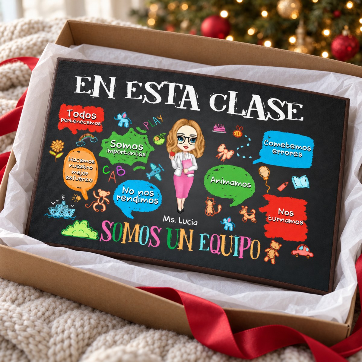 Custom Spanish teacher canvas in an open gift box with white tissue paper and red ribbon