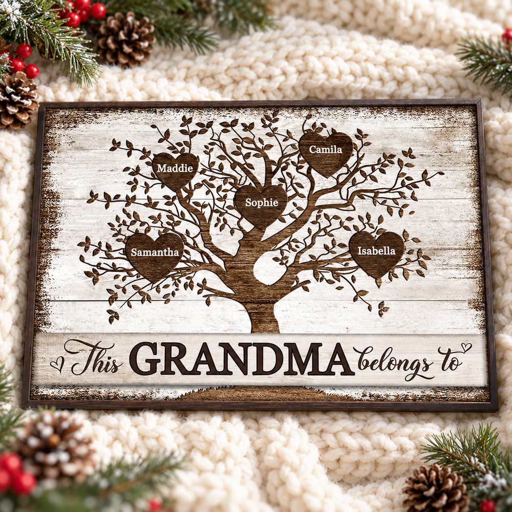 Personalized Grandma family tree canvas lying on a chunky knit throw with festive greenery