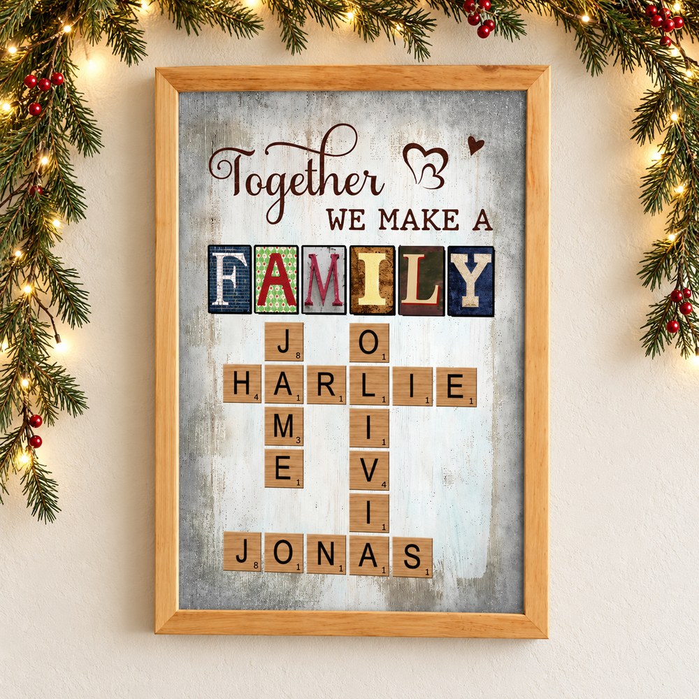 Together We Make A Family crossword framed canvas print on a wall with Christmas pine garland