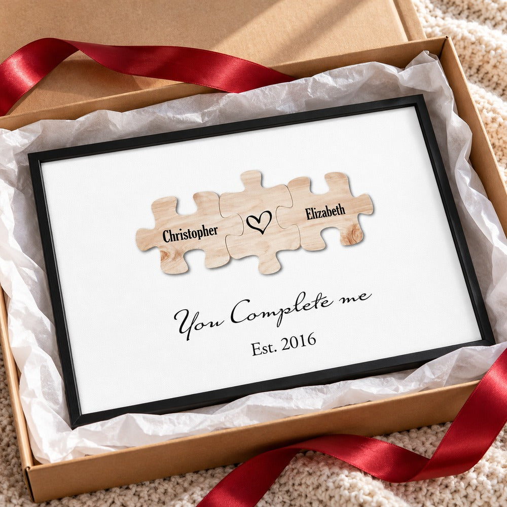 Personalized couple puzzle canvas print in open holiday gift box with red ribbon